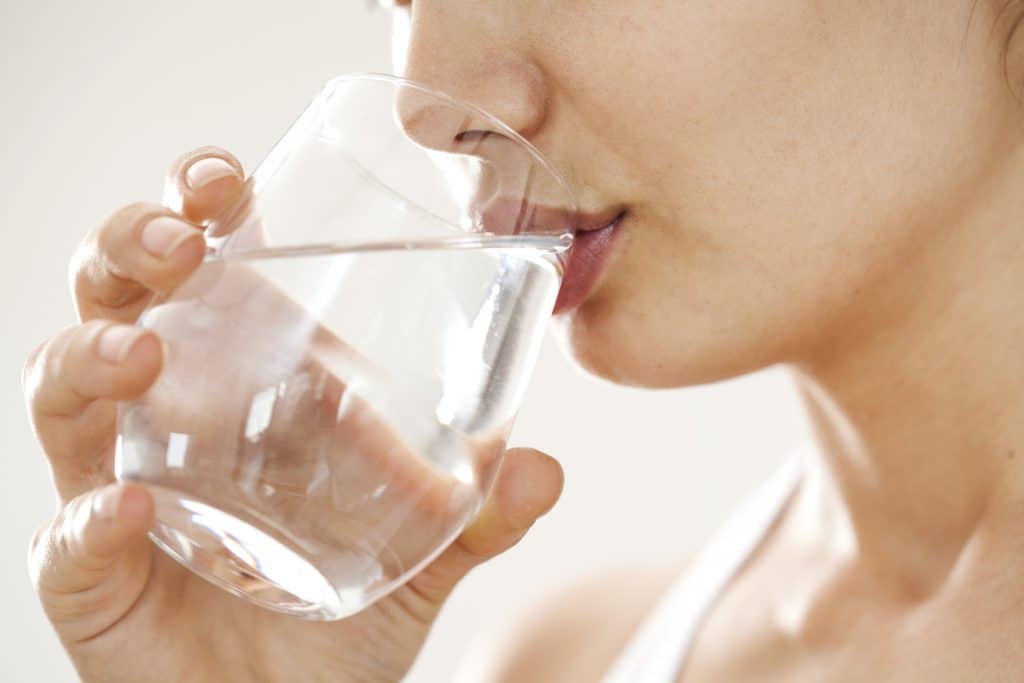 woman drinking glass of water